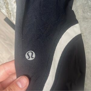 size 8 lululemon, mesh on bottom of leg, zipper at waist